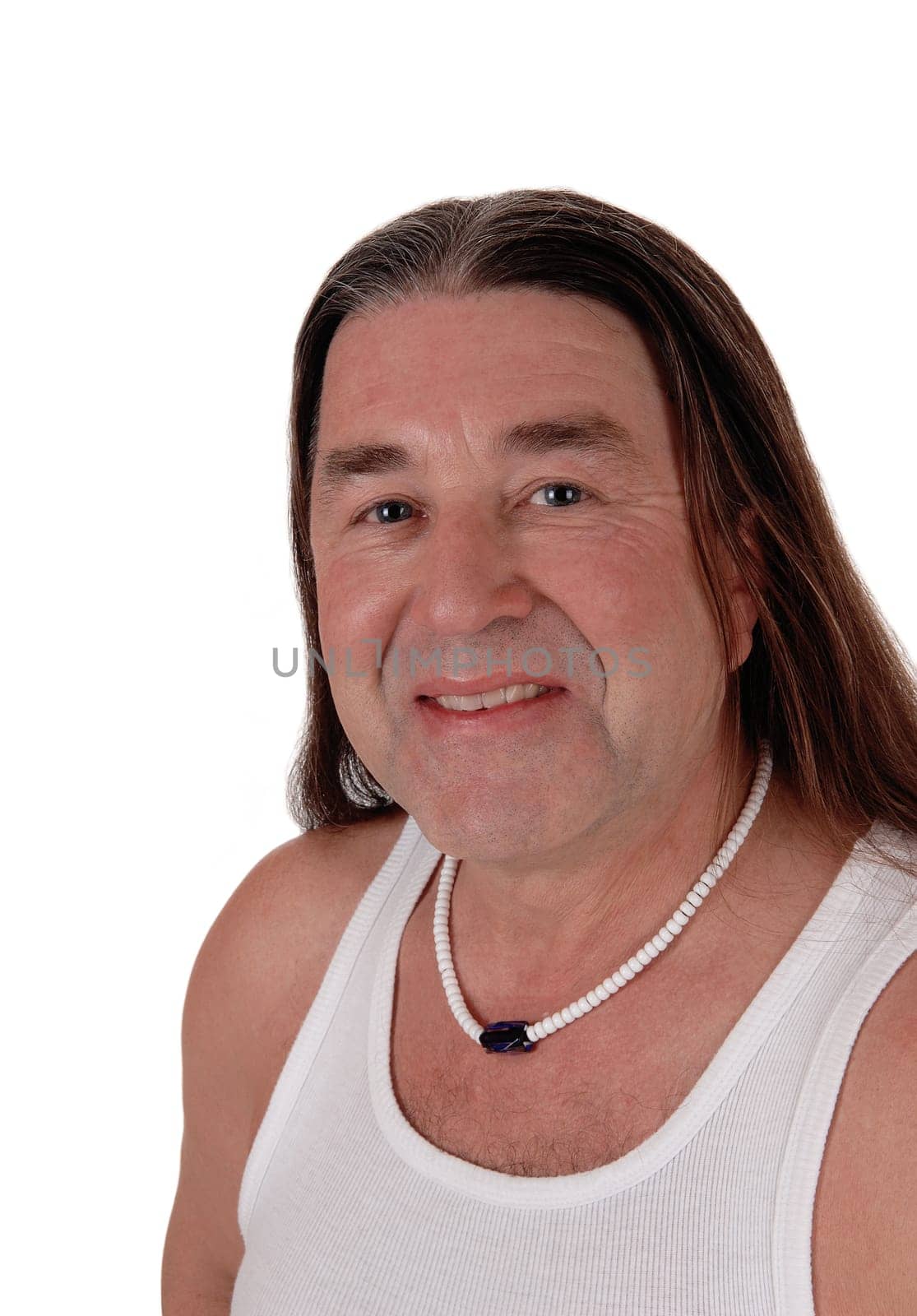 A happy indigenous man posing for a portrait image with.his long brunette hair, isolated for white background.