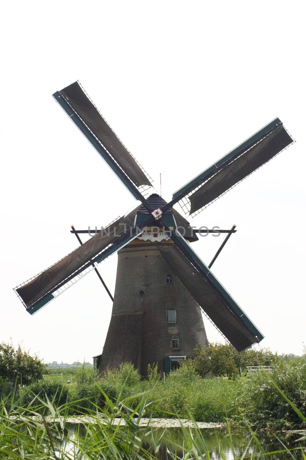 A beautiful, old, historic windmill, with four wings