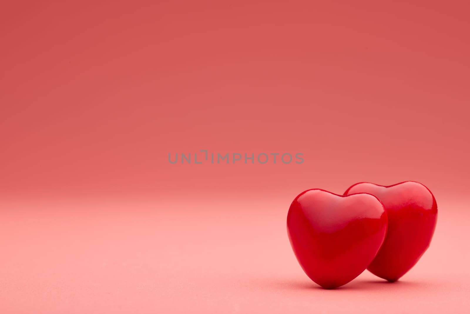 Two decorative hearts on pink background with copy space. Valentine's Day. Wedding Day. Design element for romantic greeting card,  invitation.