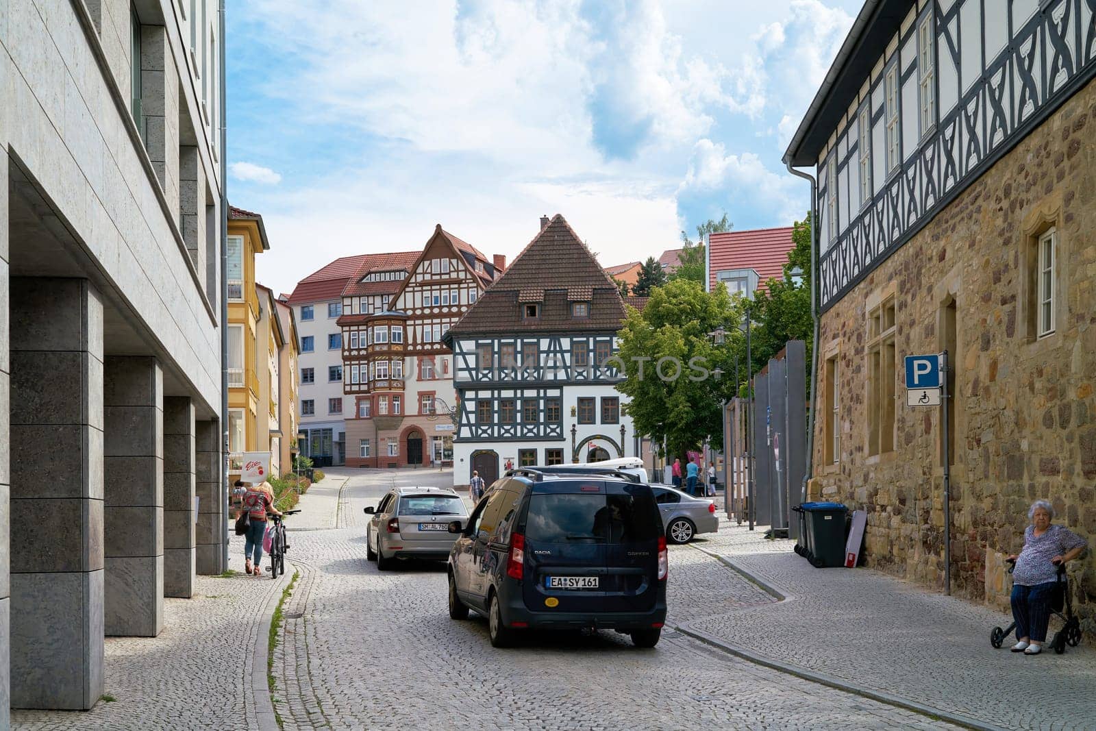 Road traffic in the old town of Eisenach. In the middle of the picture is the Luther House.