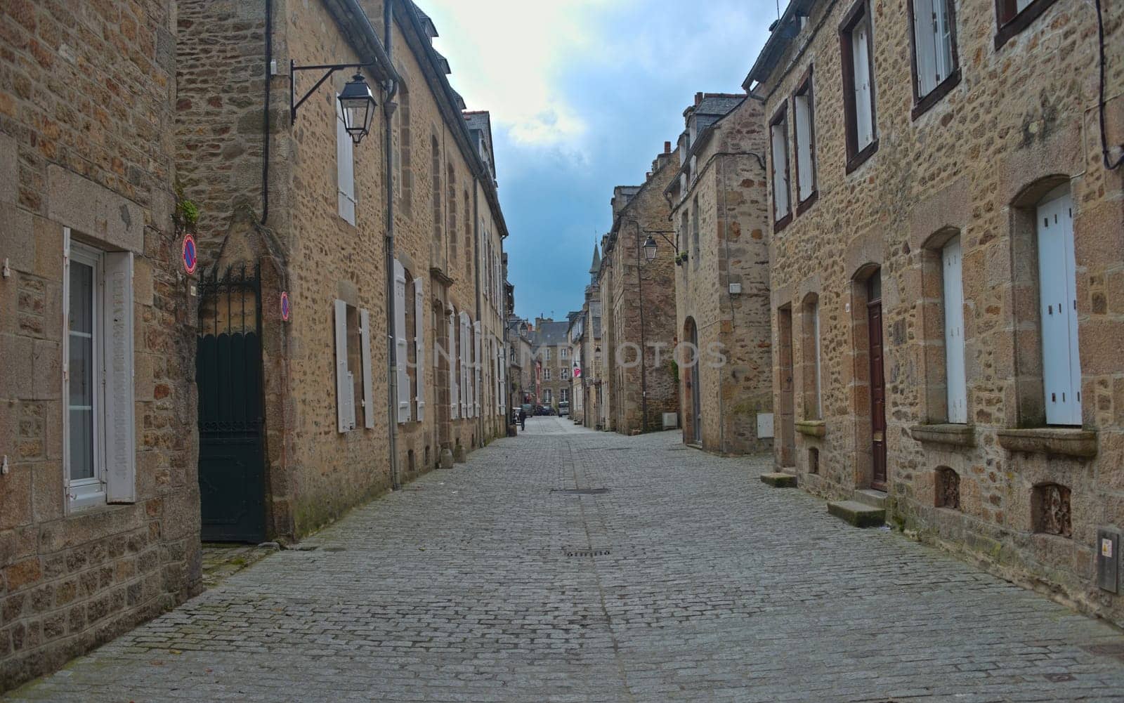 Empty street with traditional stone houses at Dinan, France