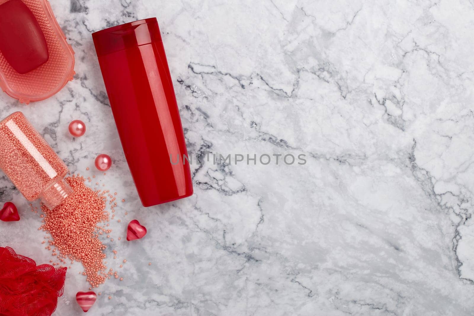 Spa still life with toiletry and  hearts on light  gray marble background. Top view with copy space. Healthy lifestyle, body care, Spa treatment. Valentine