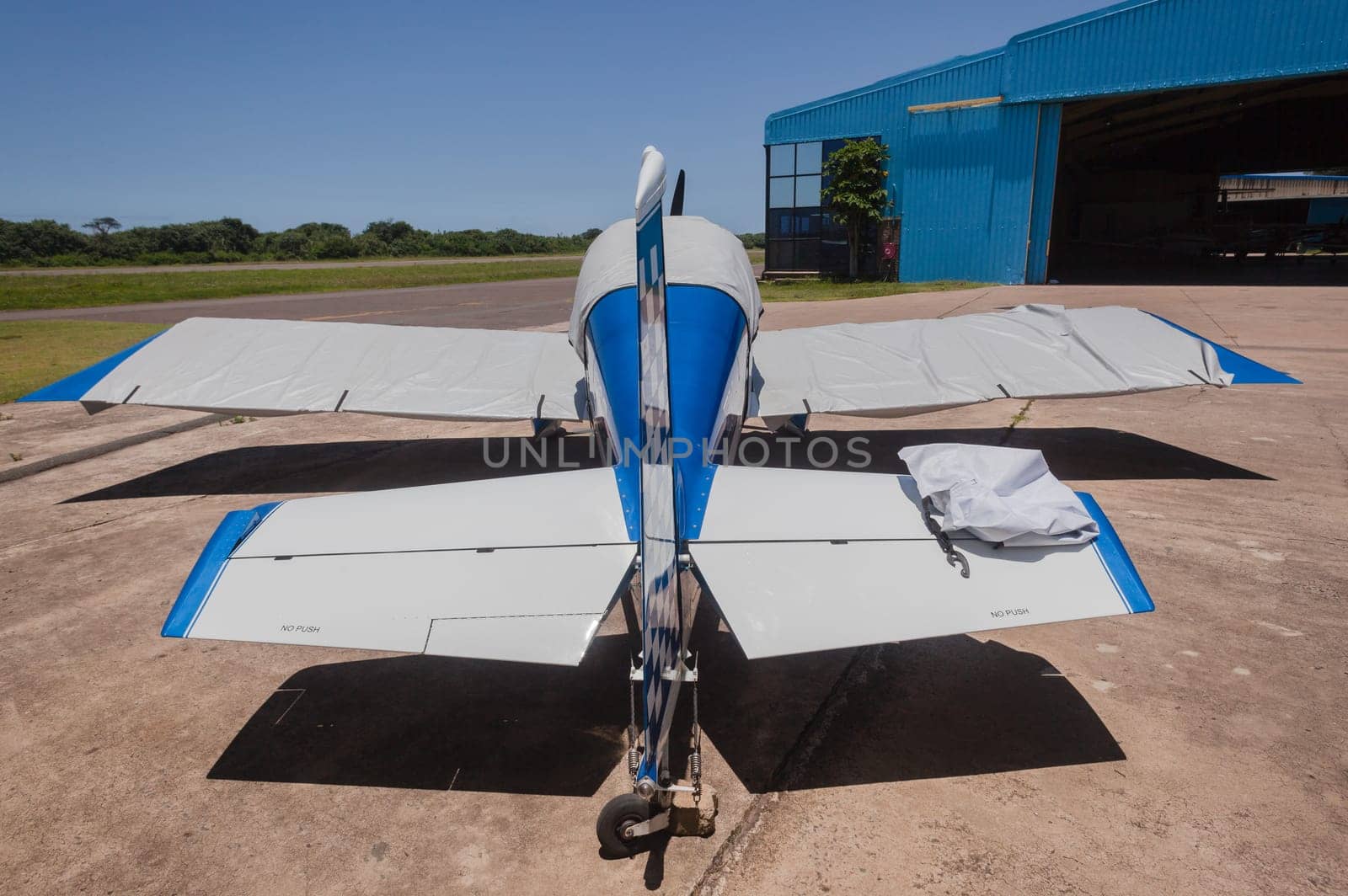 Small two seater prop plane aircraft covered .