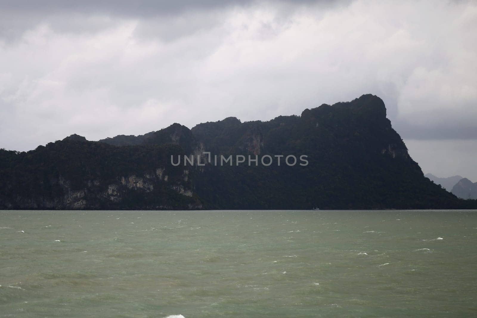 beautiful seascape with the island on the background of blue sky with