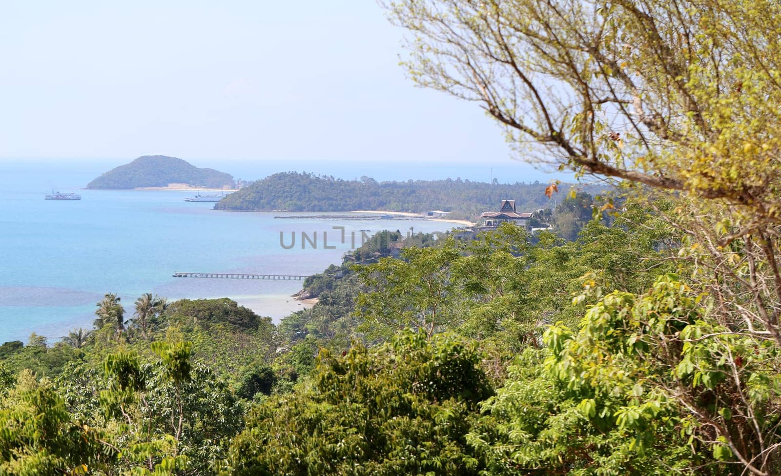 beautiful seascape with the island on the background of blue sky with