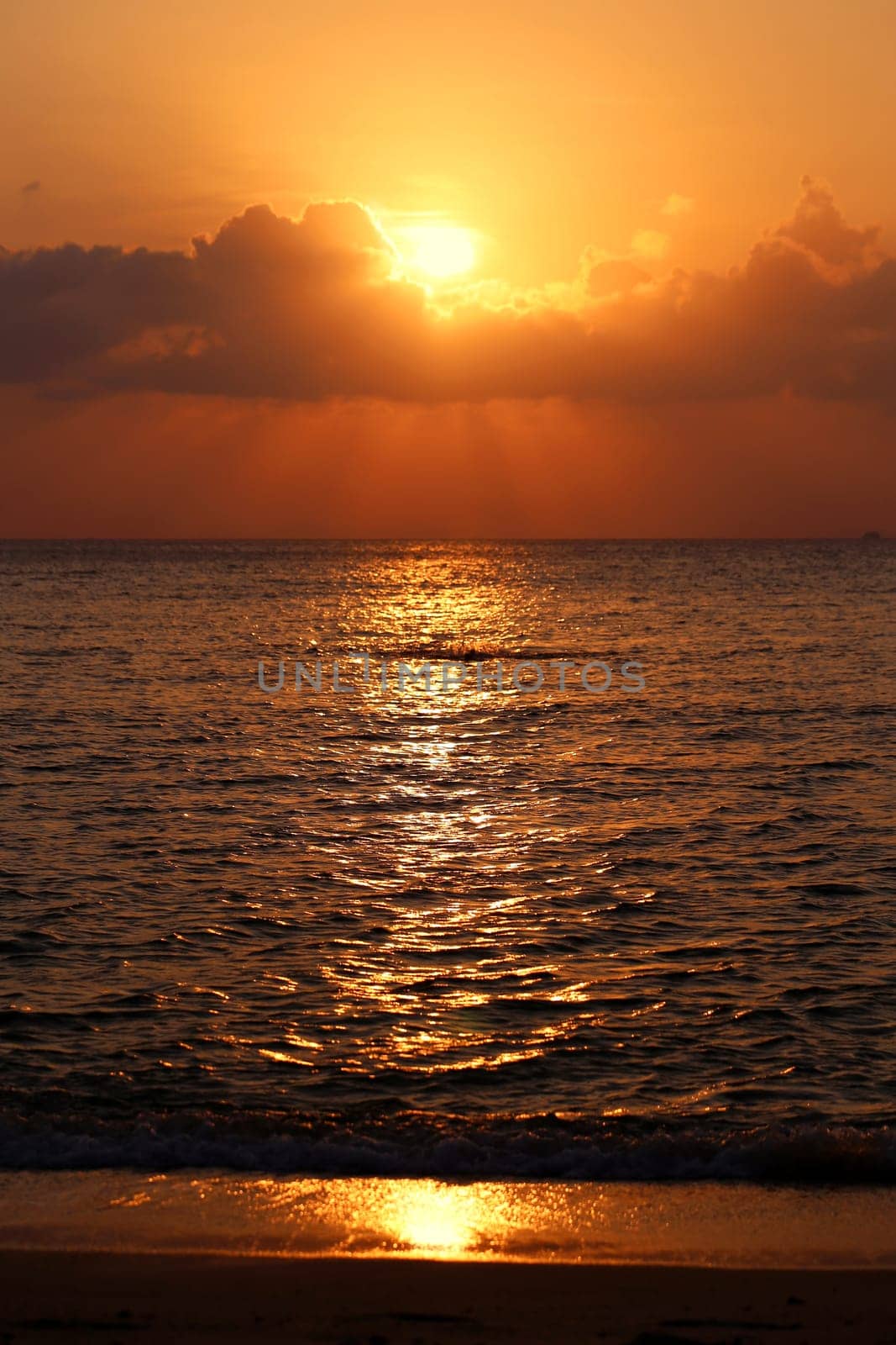 Sunset in the sea among the clouds