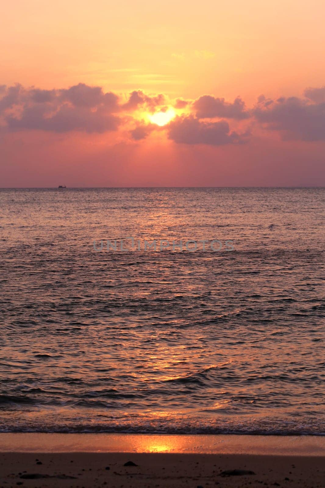 Sunset in the sea among the clouds
