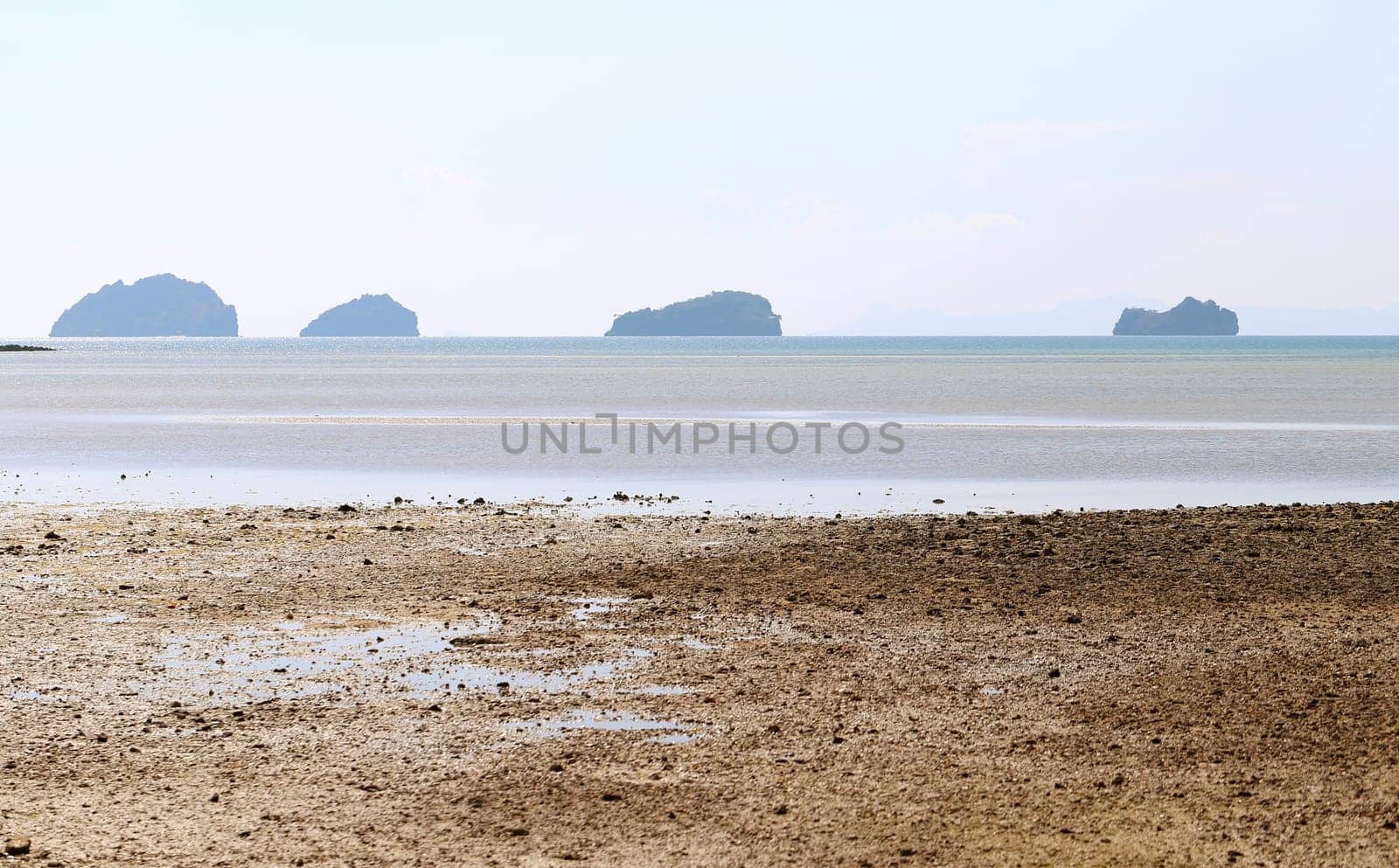 beautiful seascape with the island on the background of blue sky with