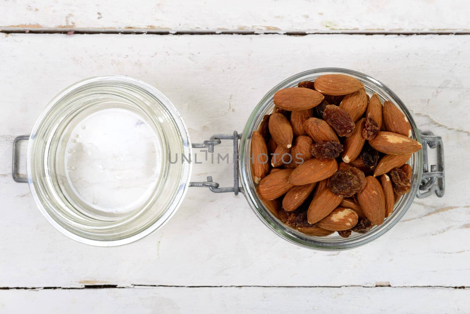 almonds with raisins dry in a glass jar