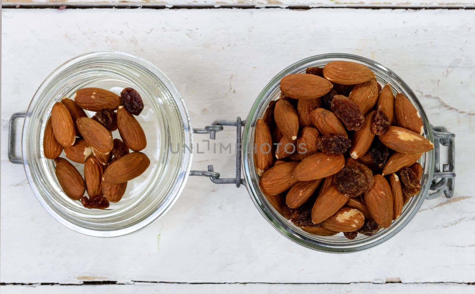 almonds with raisins dry in a glass jar
