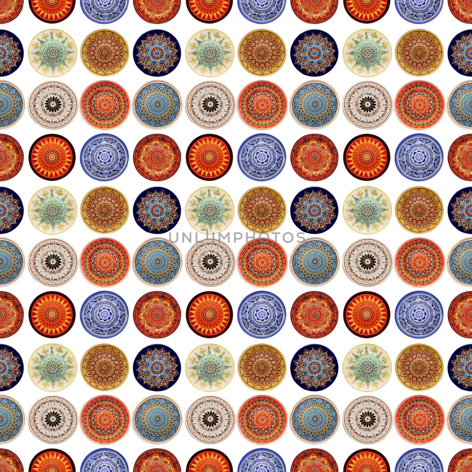 Seamless background from a set of decorative ceramic dishes hand-painted with acrylic paints with a floral pattern.
