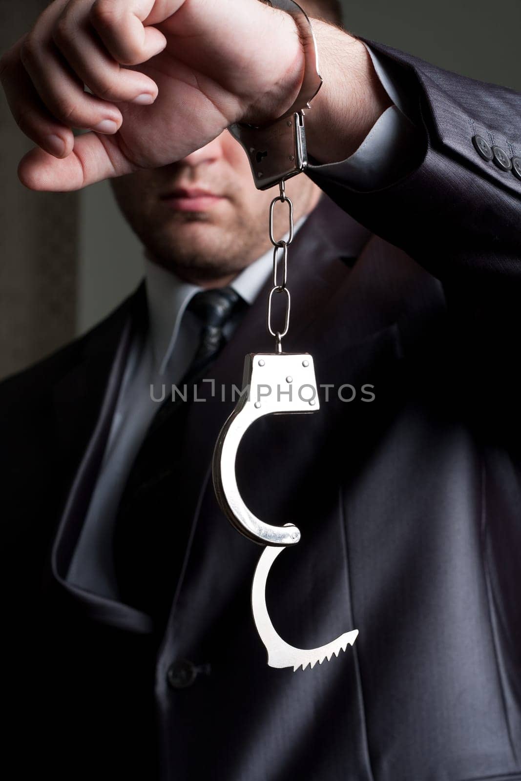 Freedom - businessman with unlocked handcuffs on hand