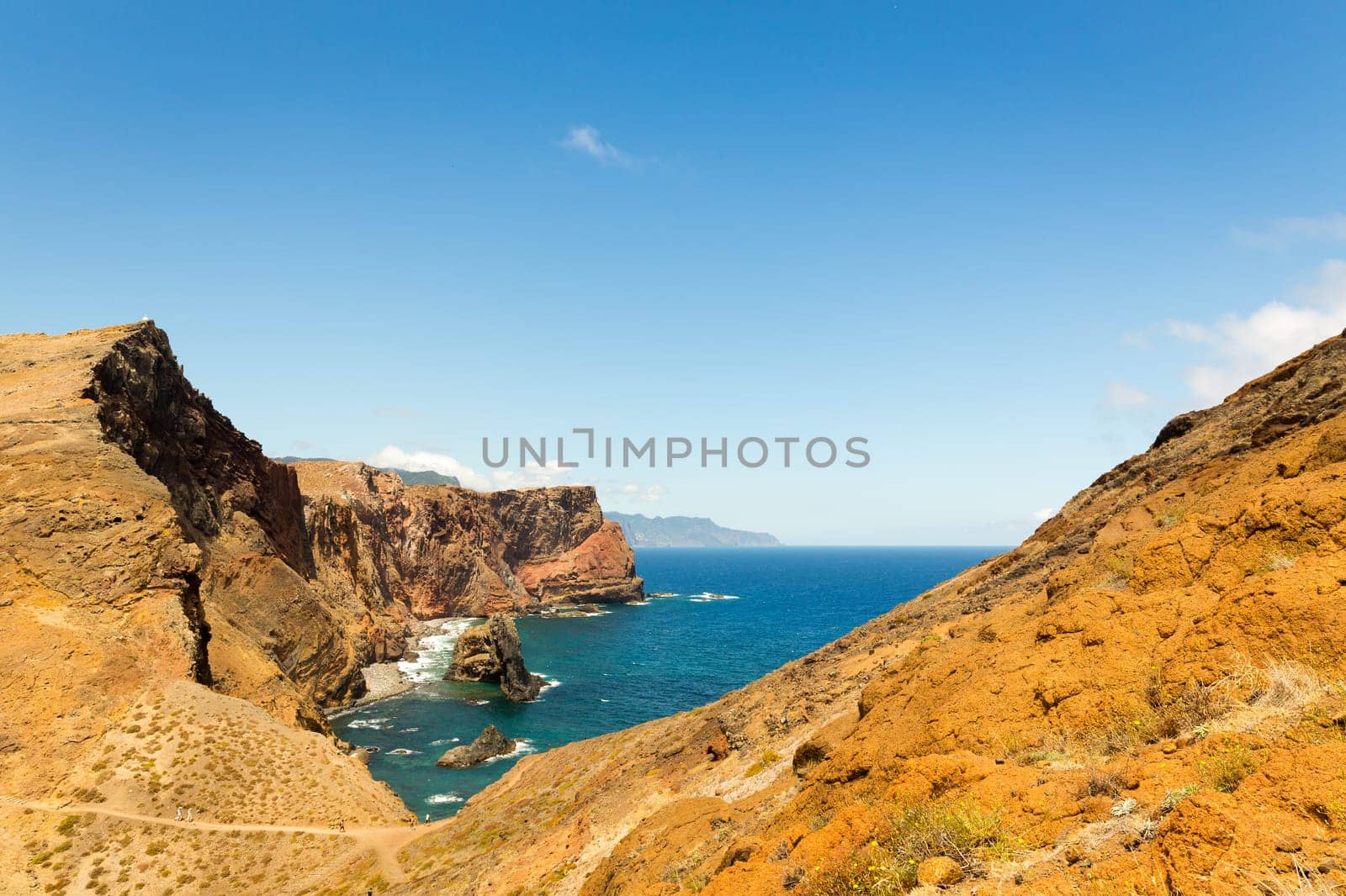 Summer ocean with rocky cliffs in sunny day
