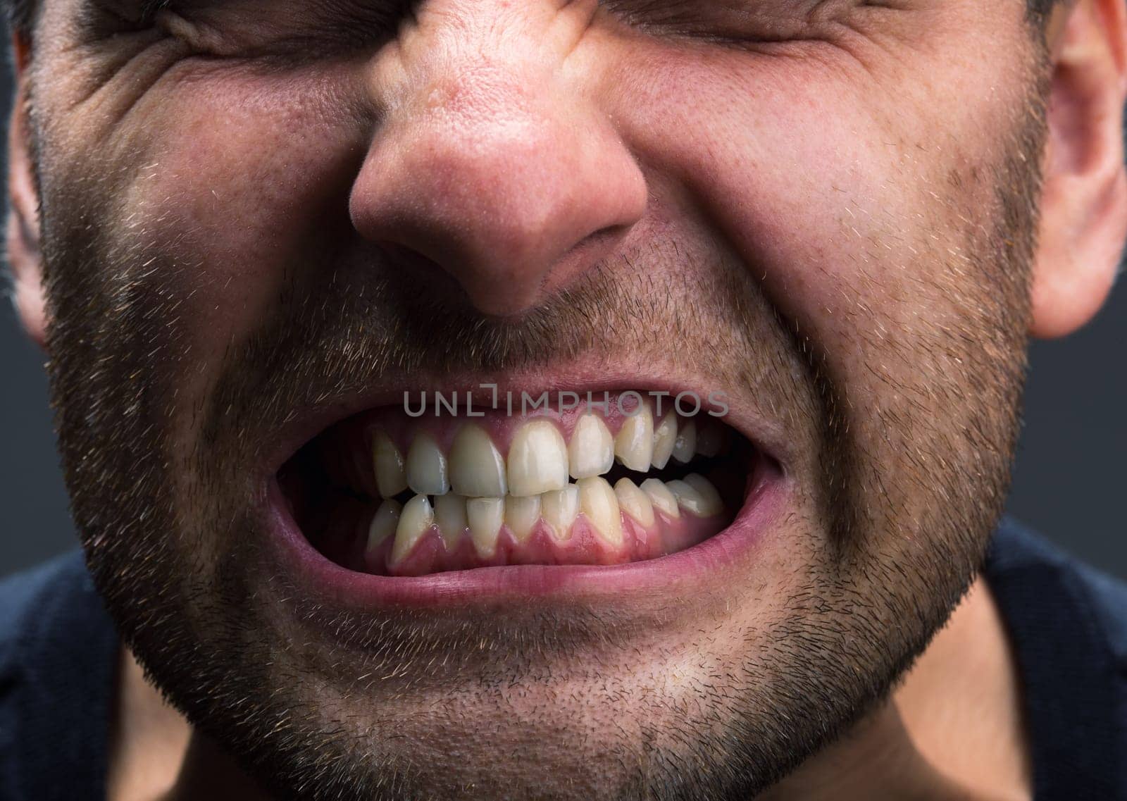 Closeup of mouth of very stressed man