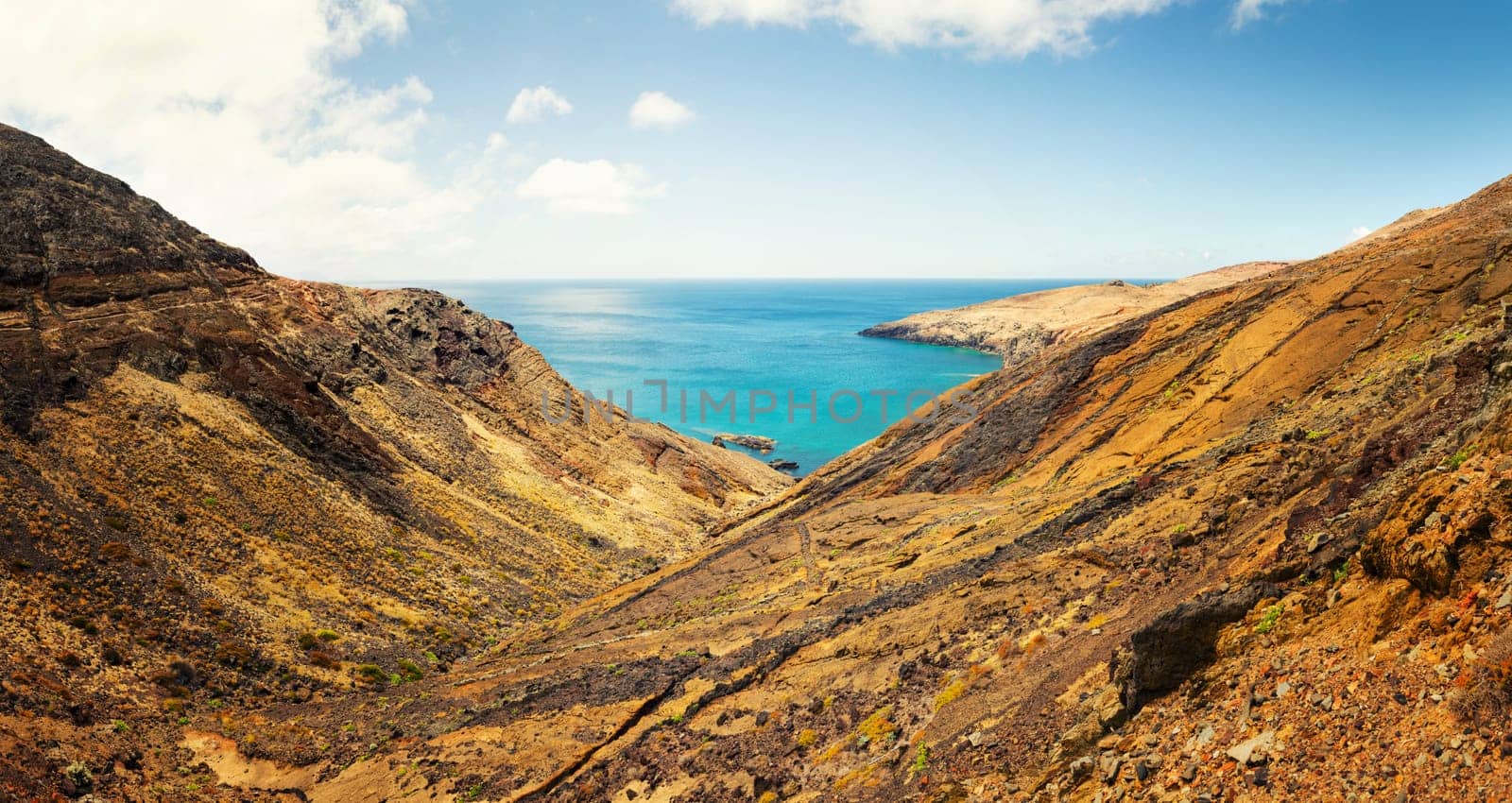 Panoramic view of the ocean bay and desert valley