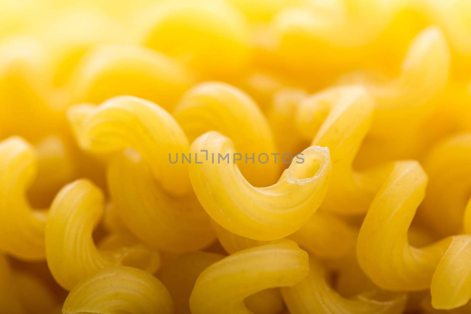 Heap of yellow macaroni. Macro view