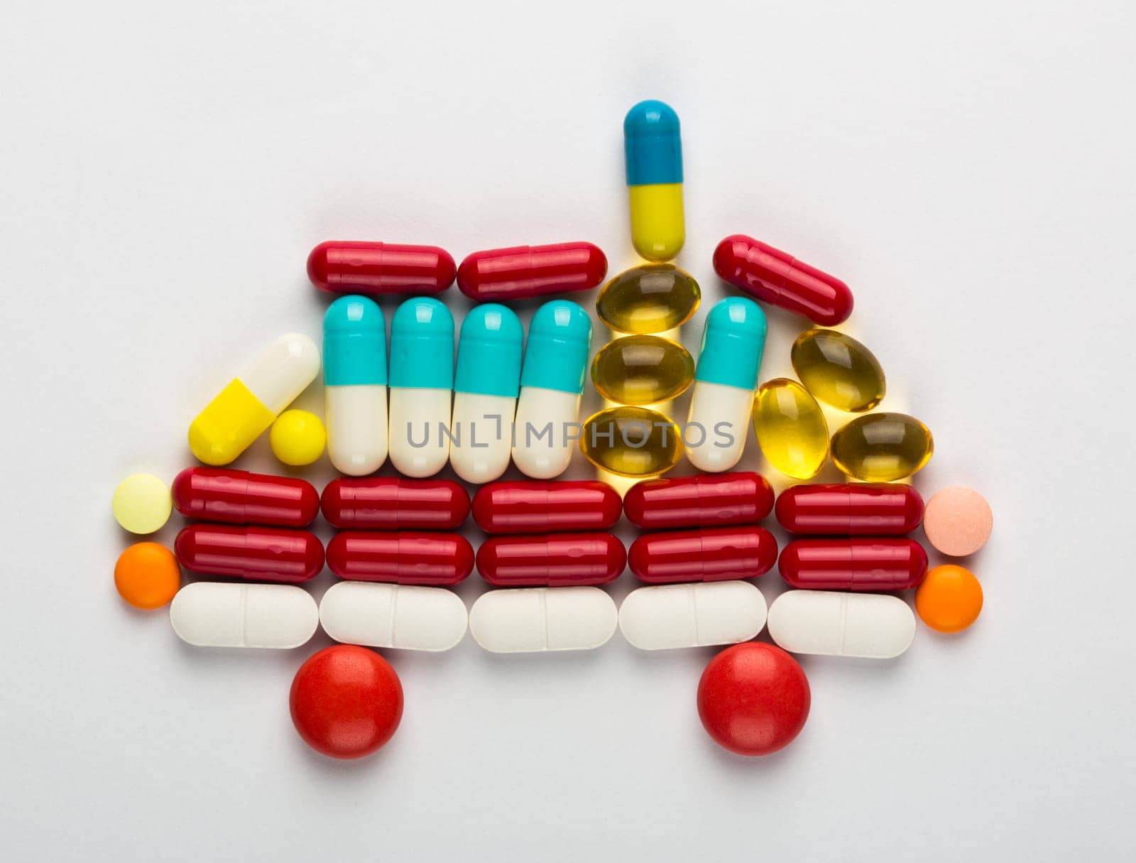 Ambulance car symbol made from colorful medicines