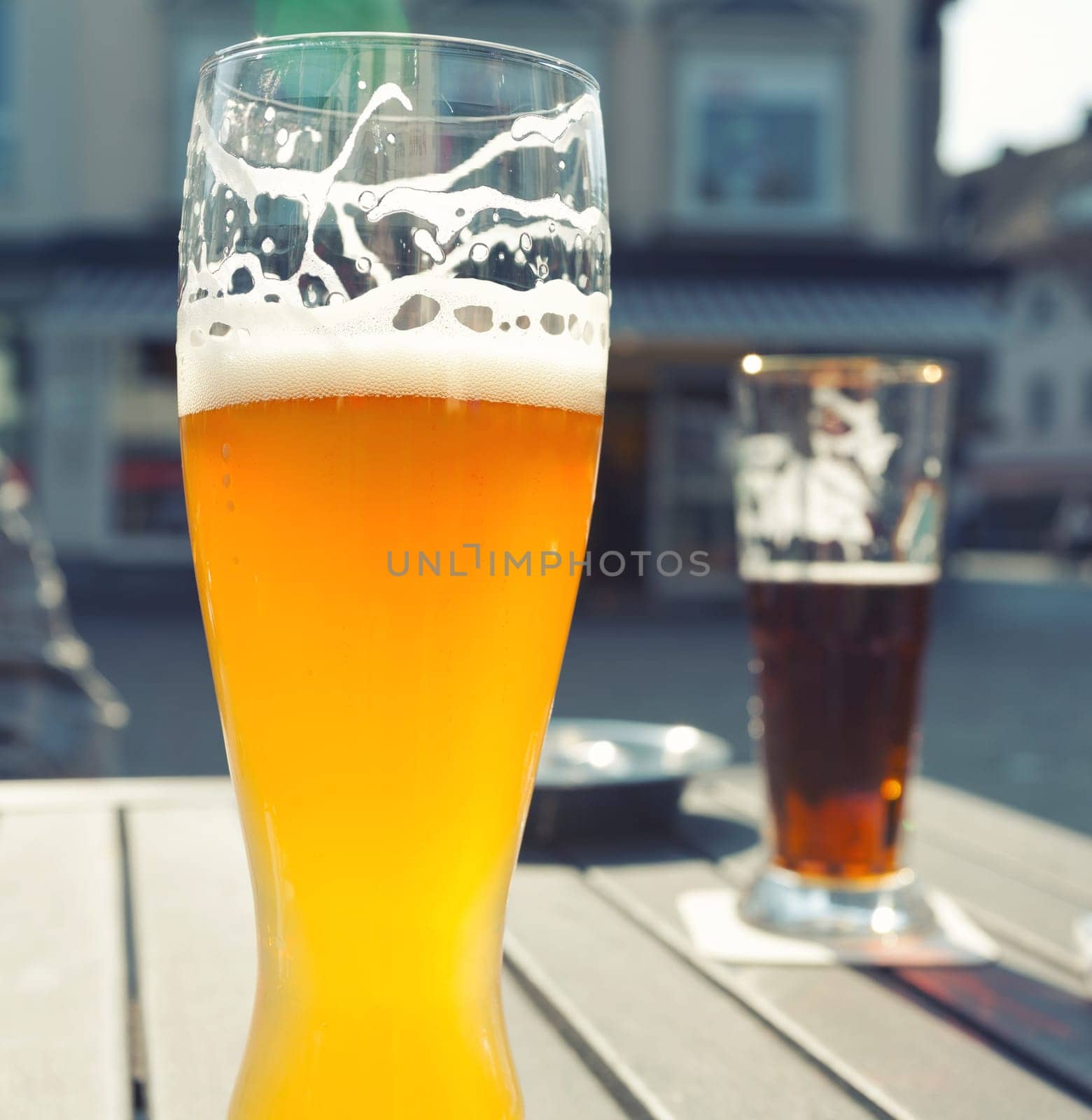 Glass of beer on an outdoor patio