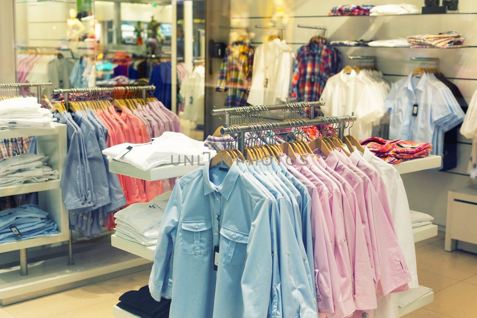 Shirts on hangers in fashion store