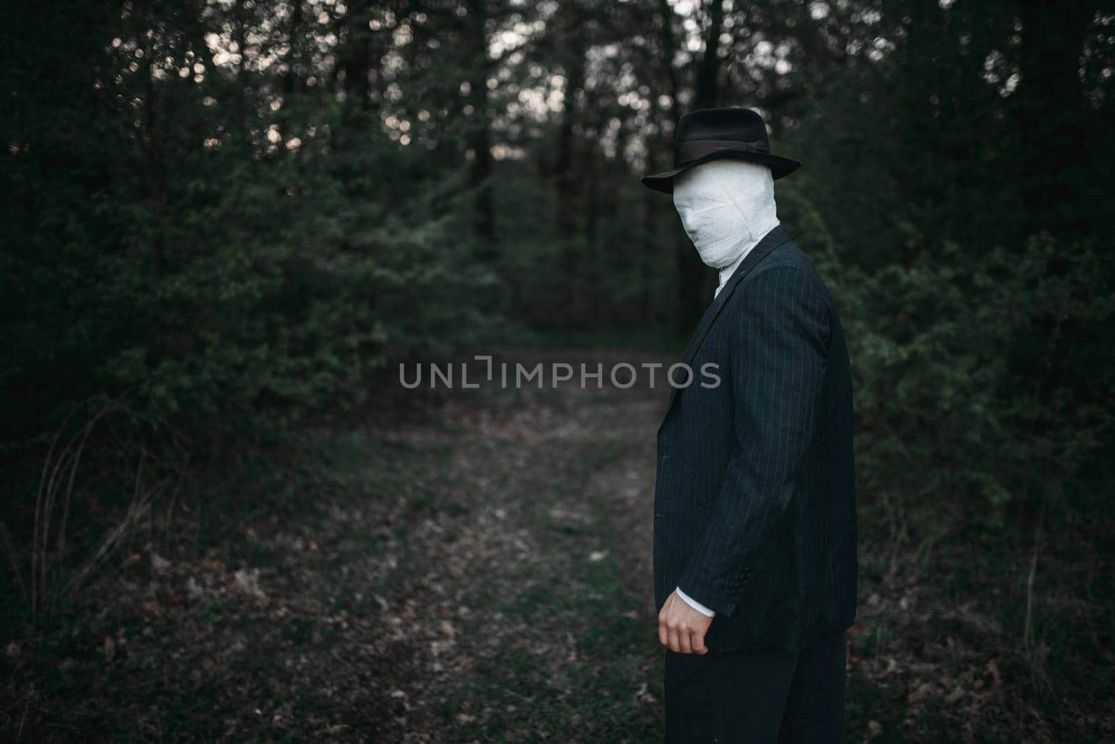 Serial maniac with face wrapped in bandages, bloody killer concept, crazy murderer, crime and violence horror