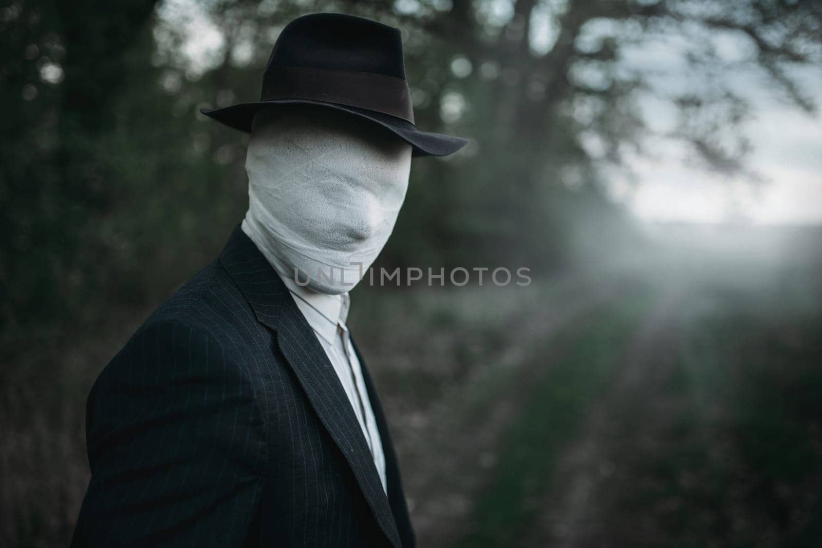 Serial maniac in the night forest, face wrapped in bandages, bloody killer concept, crazy murderer, crime and violence horror