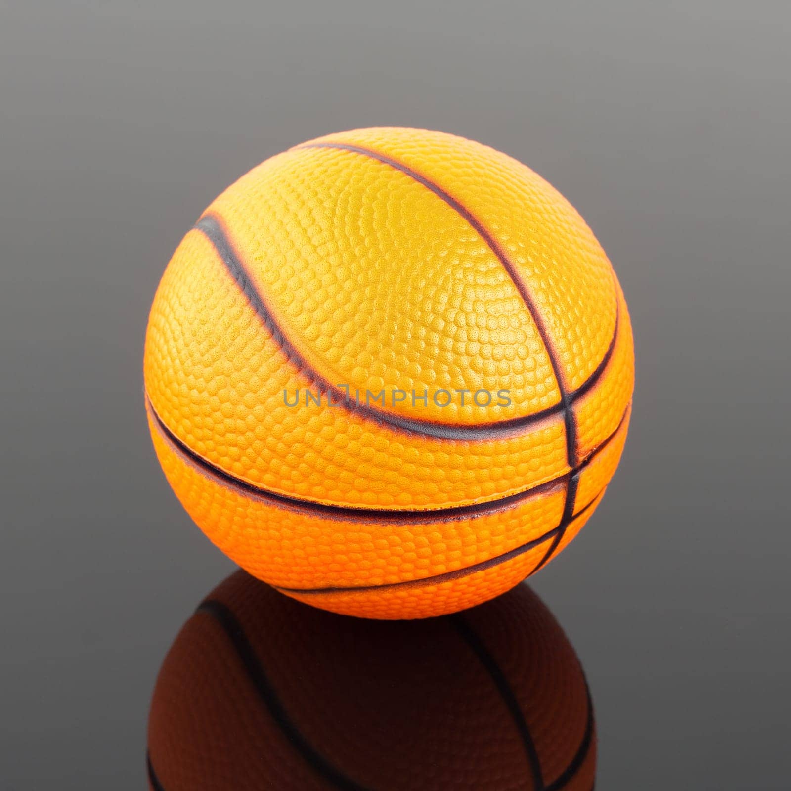 Close-up of classic basketball with reflection in mirror