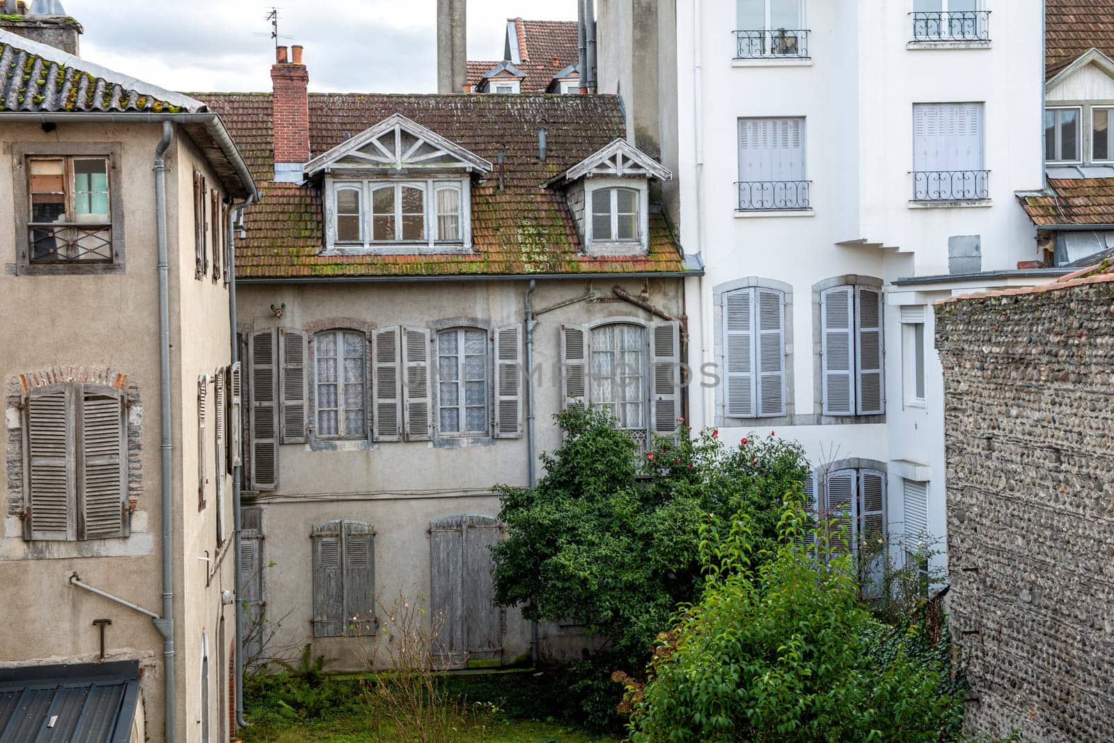 a facade of old building, french town