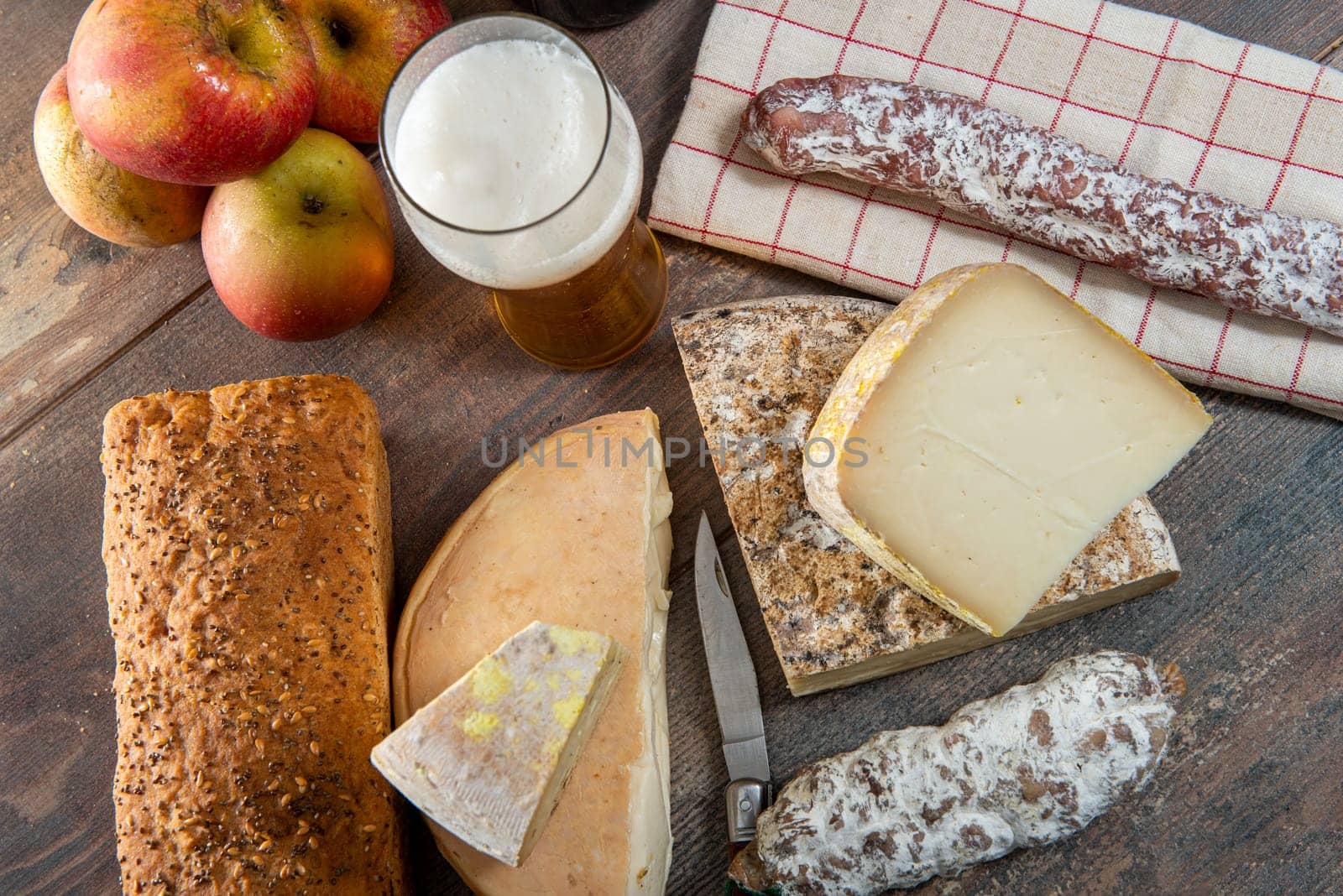 cheeses and Tomme de Savoie with beer, French cheese Savoy, the french Alps France.