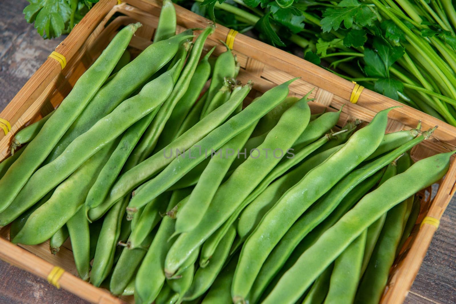 organic flat beans on the wooden background