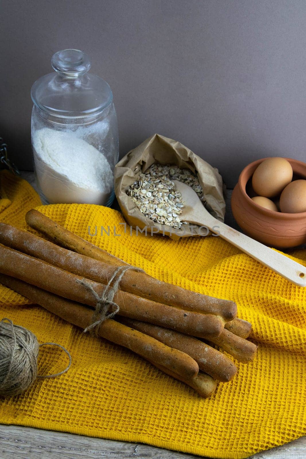 Women's hands mix the dough on a wooden table. Preparing bread for baking. Front views