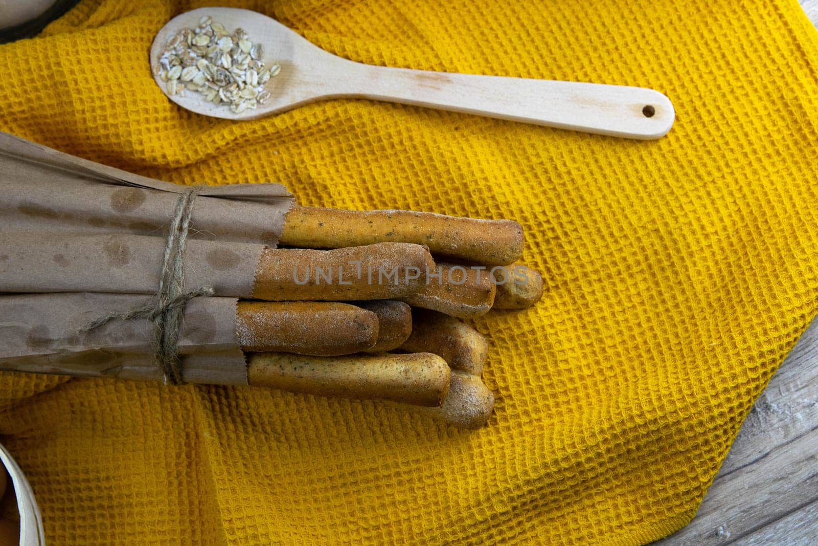 Women's hands mix the dough on a wooden table. Preparing bread for baking. Front views
