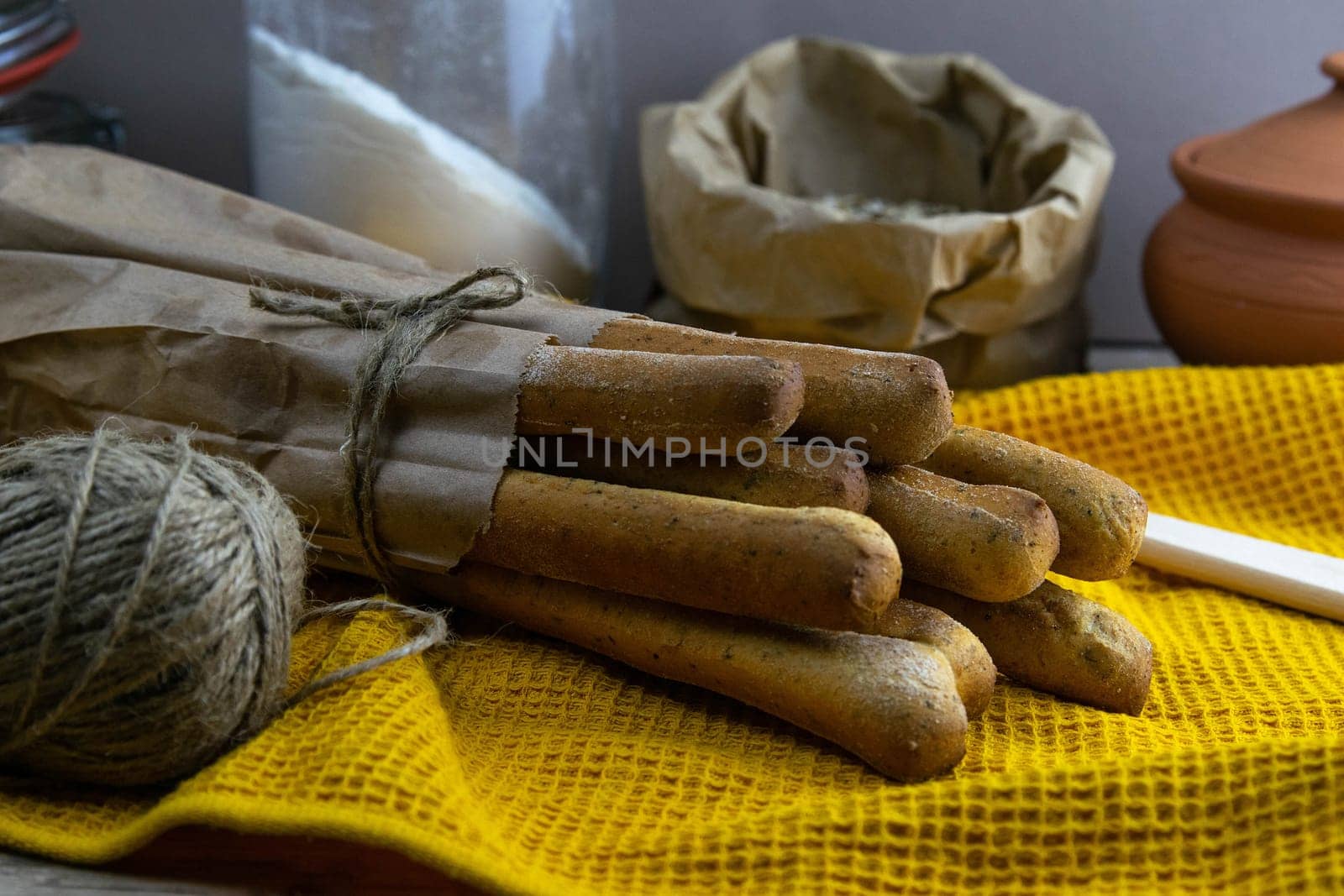 Women's hands mix the dough on a wooden table. Preparing bread for baking. Front views