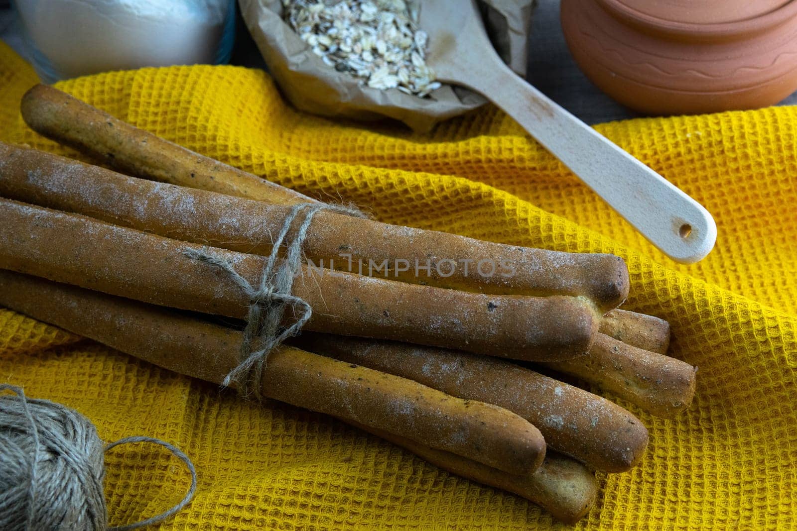 Women's hands mix the dough on a wooden table. Preparing bread for baking. Front views