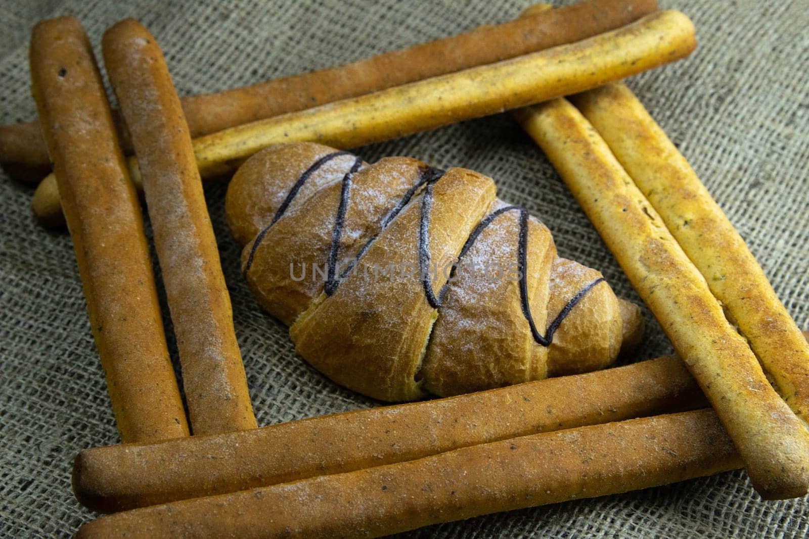 Women's hands mix the dough on a wooden table. Preparing bread for baking. Front views