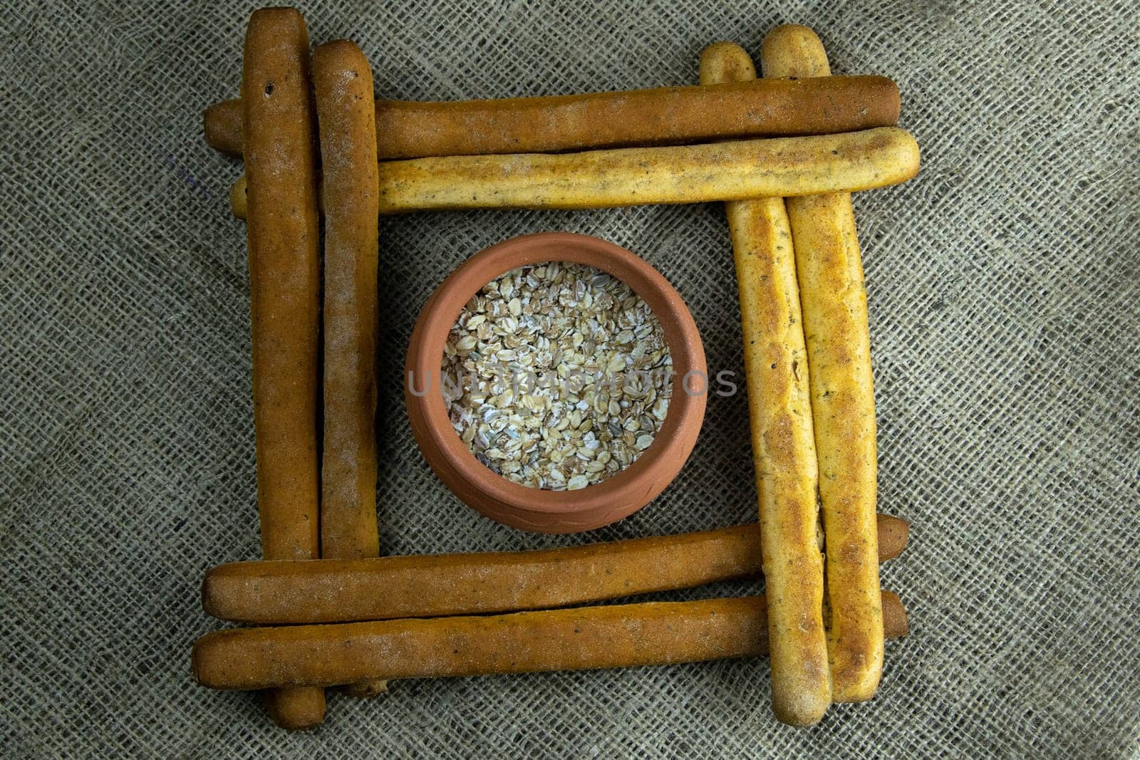 Women's hands mix the dough on a wooden table. Preparing bread for baking. Front views