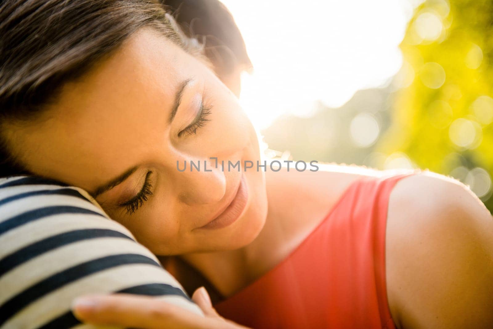 Intimate moments - young couple embracing and hugging in nature