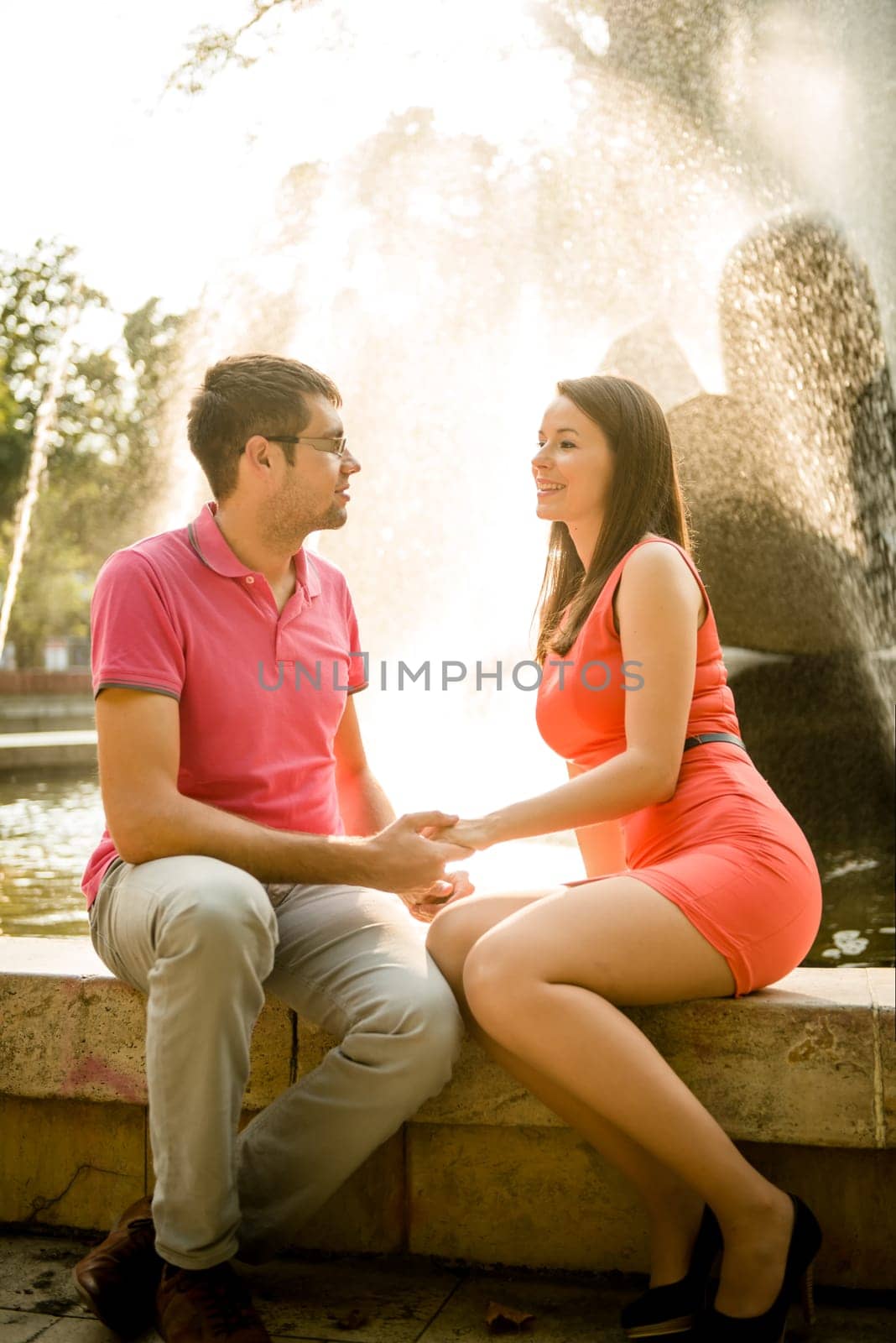 Young happy couple together outdoor talking on date