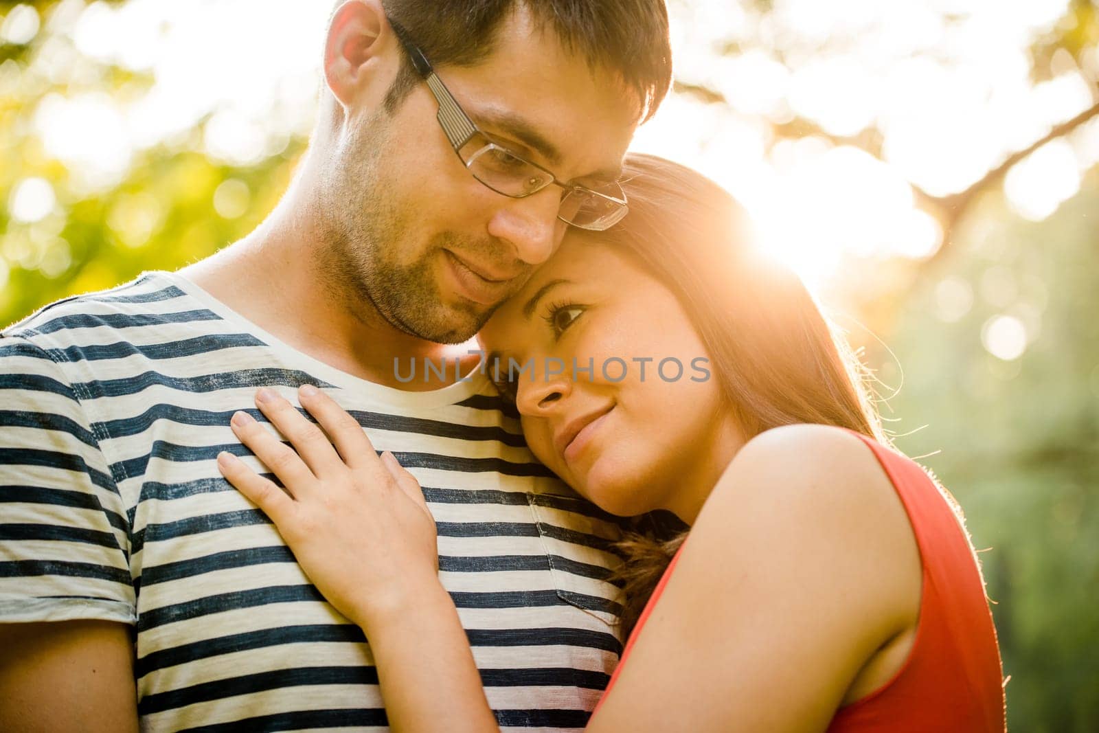 Intimate moments - young couple embracing and hugging in nature