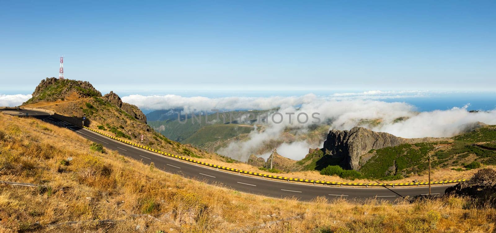 Modern runway in cloudy mountains against sky, Portugal, Madeira