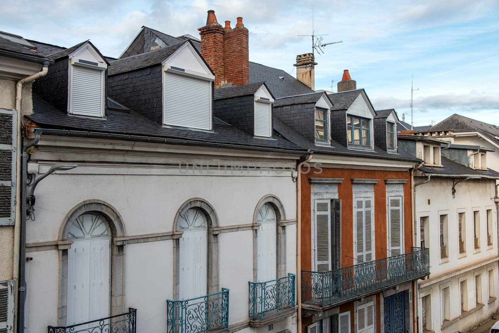 a facade of old building, french town