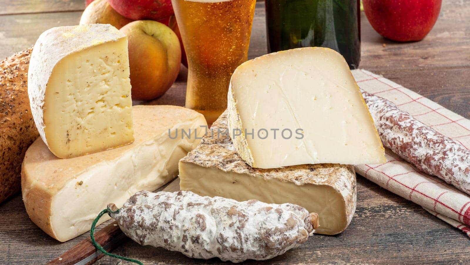 cheeses and Tomme de Savoie with beer, French cheese Savoy, the french Alps France.