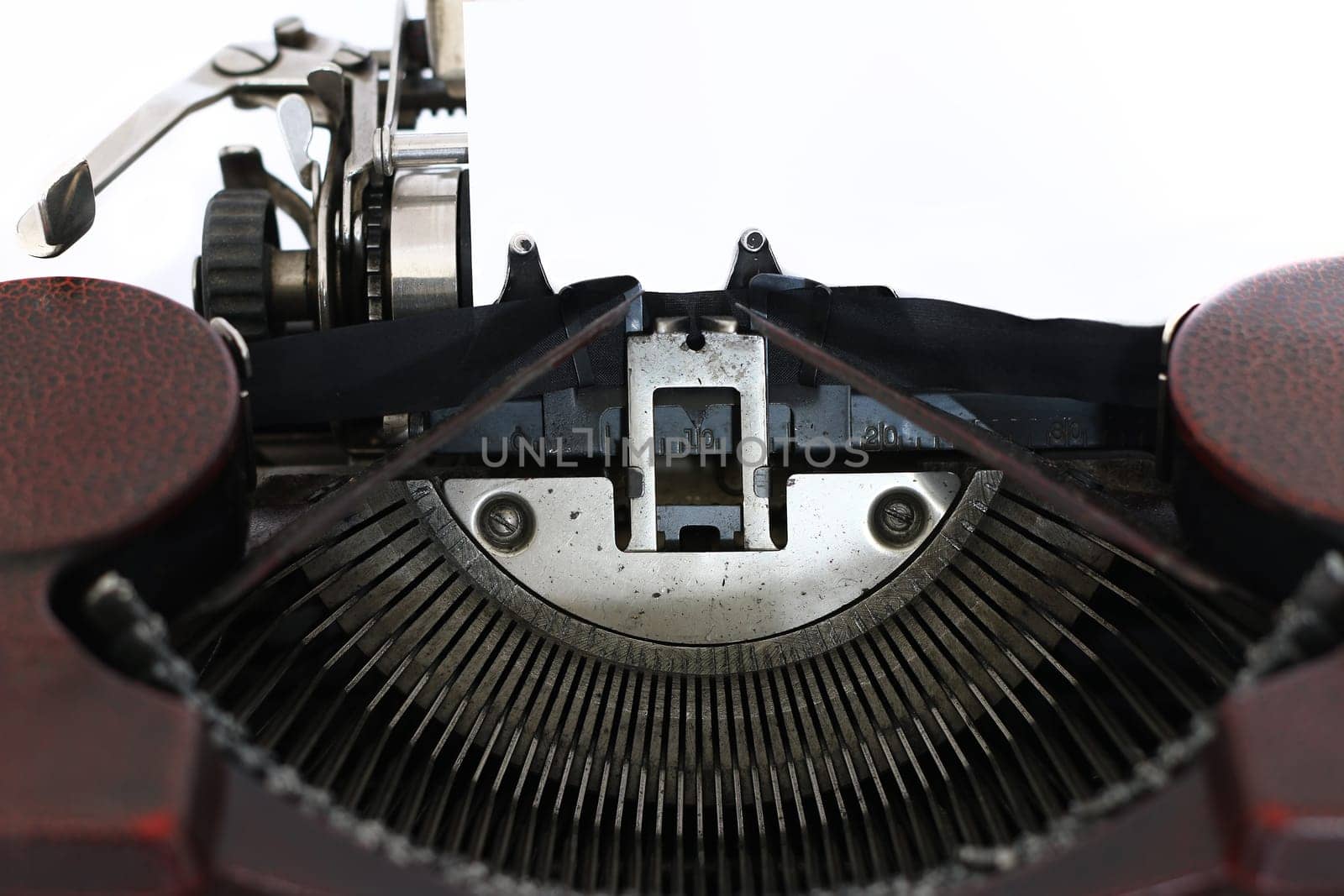 Blank paper in the old typewriter machine - detail
