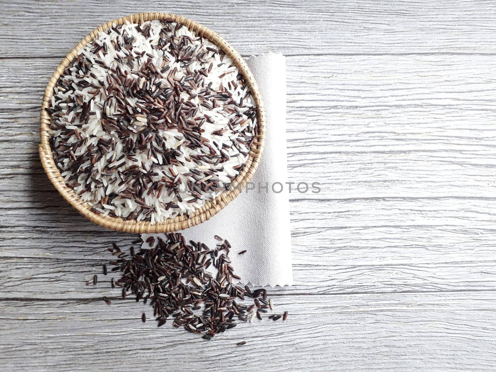 Jasmine rice and rice berry in rattan bowl