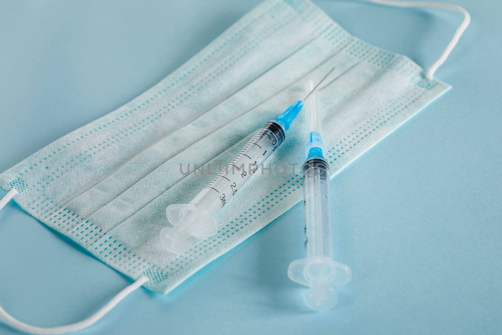Fighting the virus and the epidemic with vaccines, pills and a medical mask