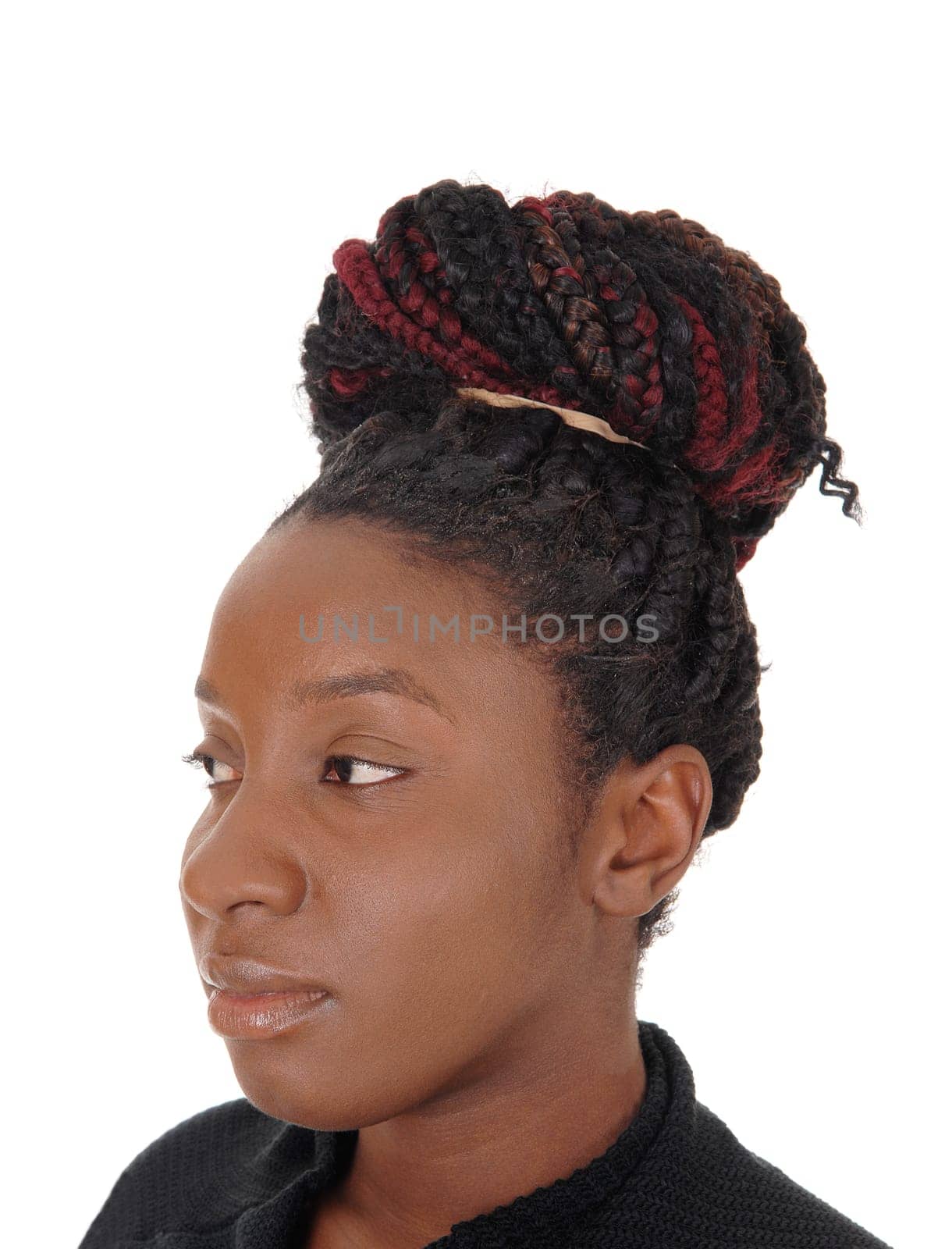 A close up image of a head shoot of an African American woman with.her braided hair as a bun, isolated for white background.