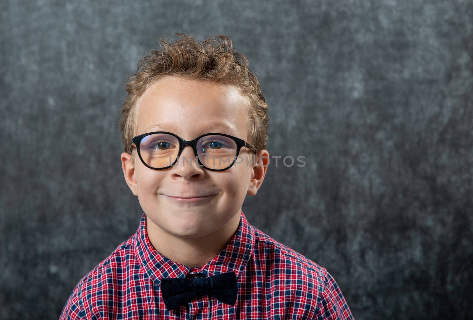 a portrait of a funny boy with glasses