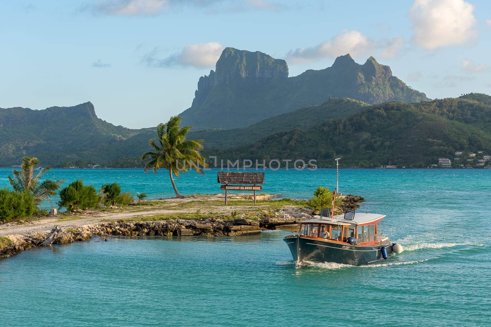 Shuttle boat at the airport,in the background volcano Mont Otemanu,Bora Bora,French Polynesia,Oceania