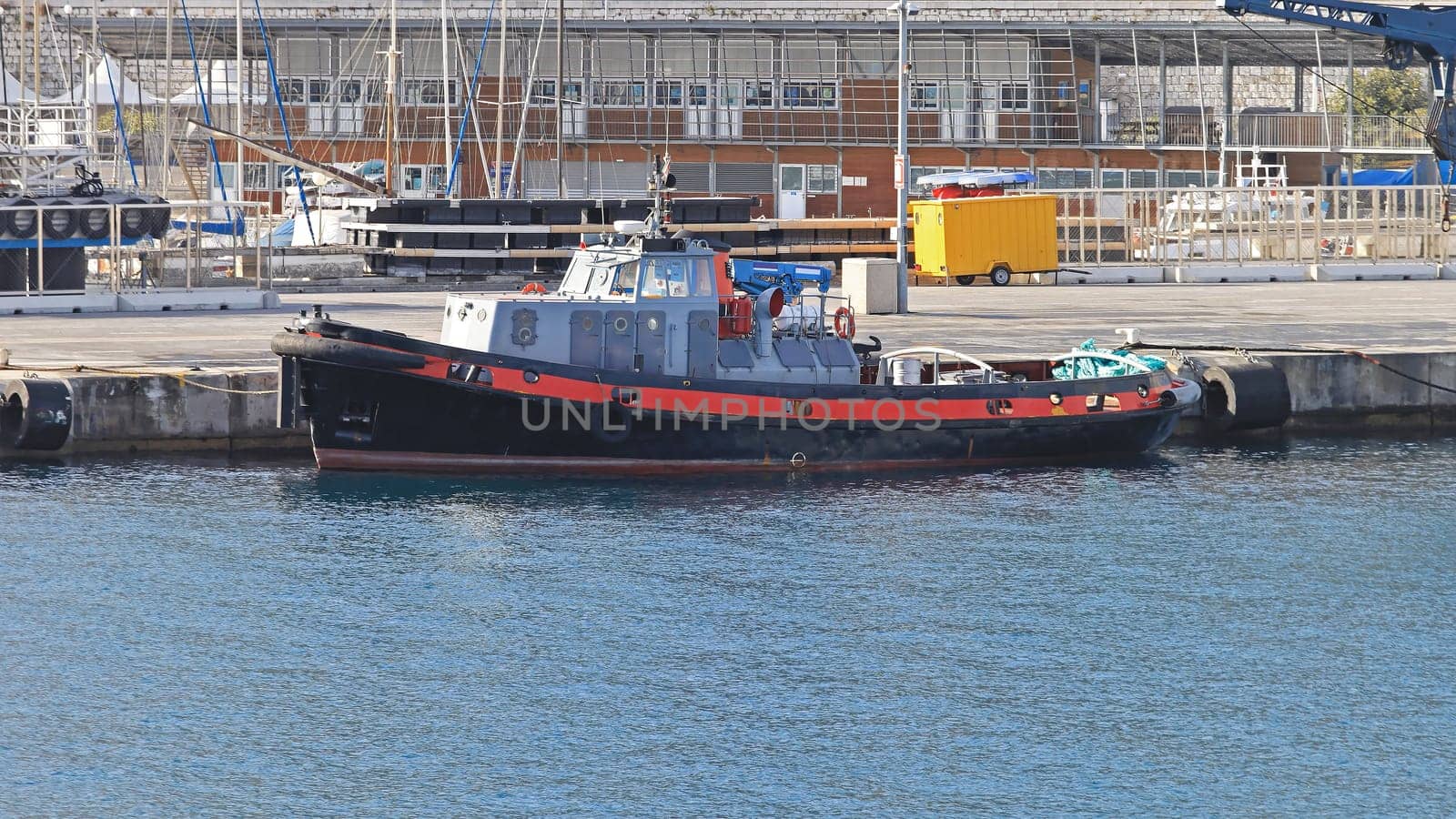 Tug boat moored at port in Nice