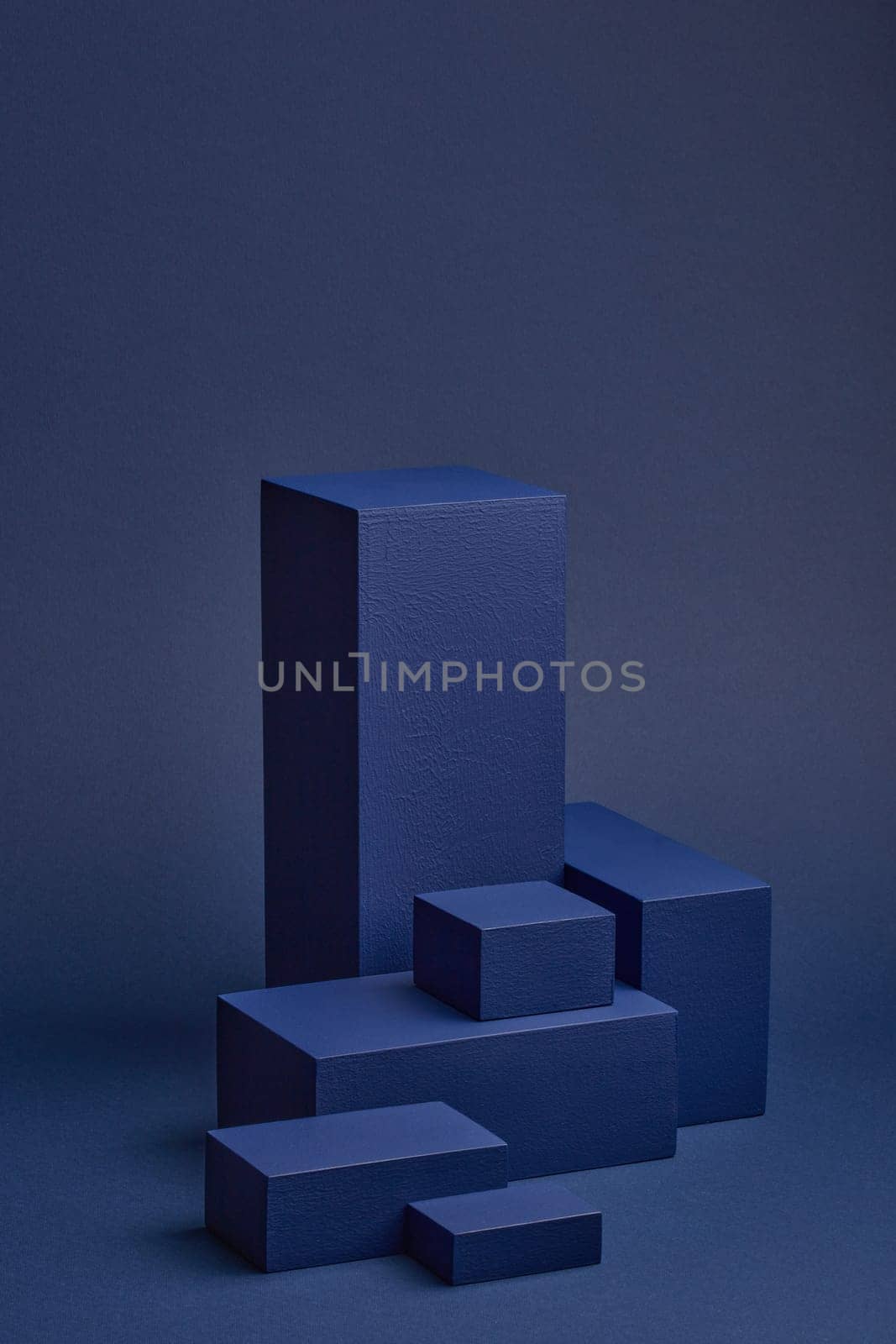 Abstract composition with geometric figures. Set of rectangular parallelepipedes on a blue background. Abstract background with copy space for design of advertising, engineering draft, web design.