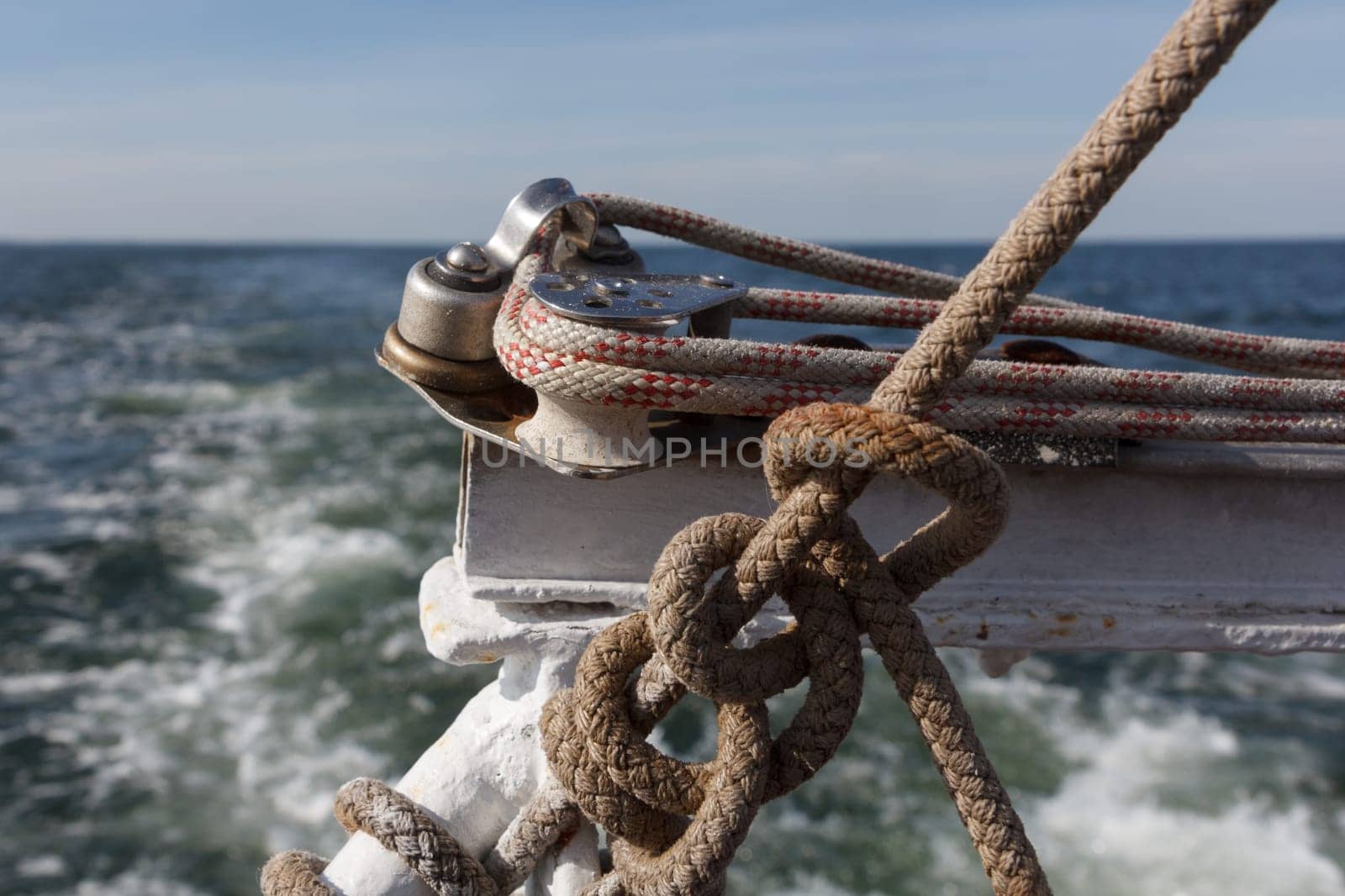 Yacht ropes and cables. Nautical knots and ropes on the yacht. Yacht accessories on the sea background